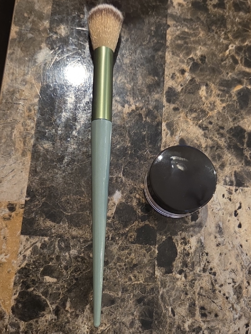 Green Makeup Brush with Laura Mercier Setting Powder